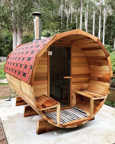 outdoor cedar sauna with front porch
