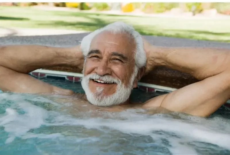 man enjoying outdoor hot tub