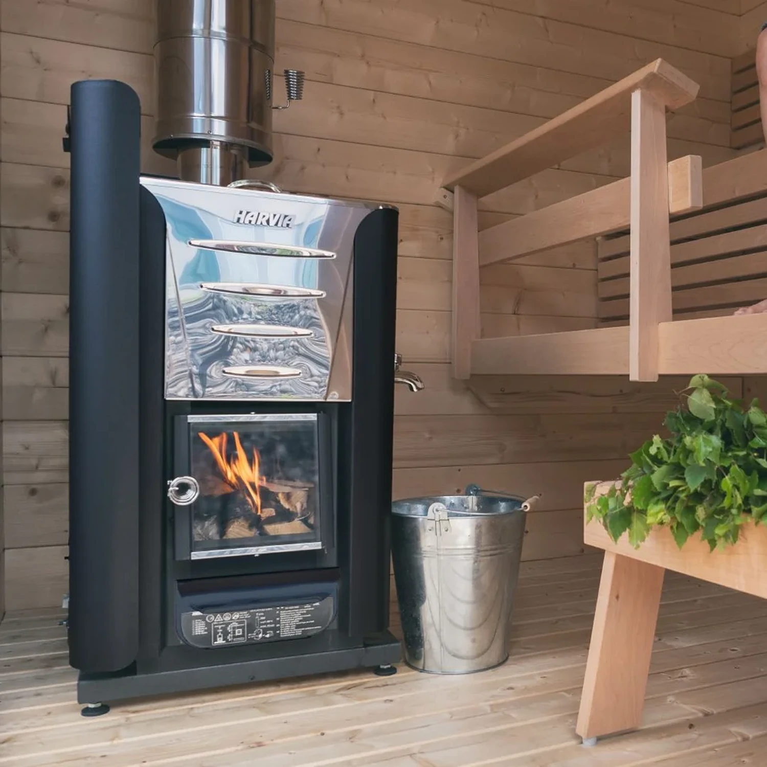 Harvia wood burning heater standing on a protective bedding in a sauna