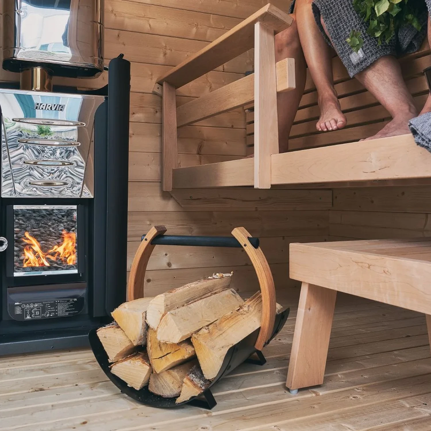 Harvia wood burning heater with a firewood basket