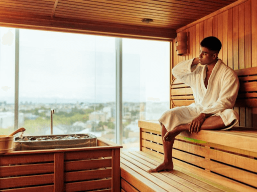 man in sauna for muscle recovery
