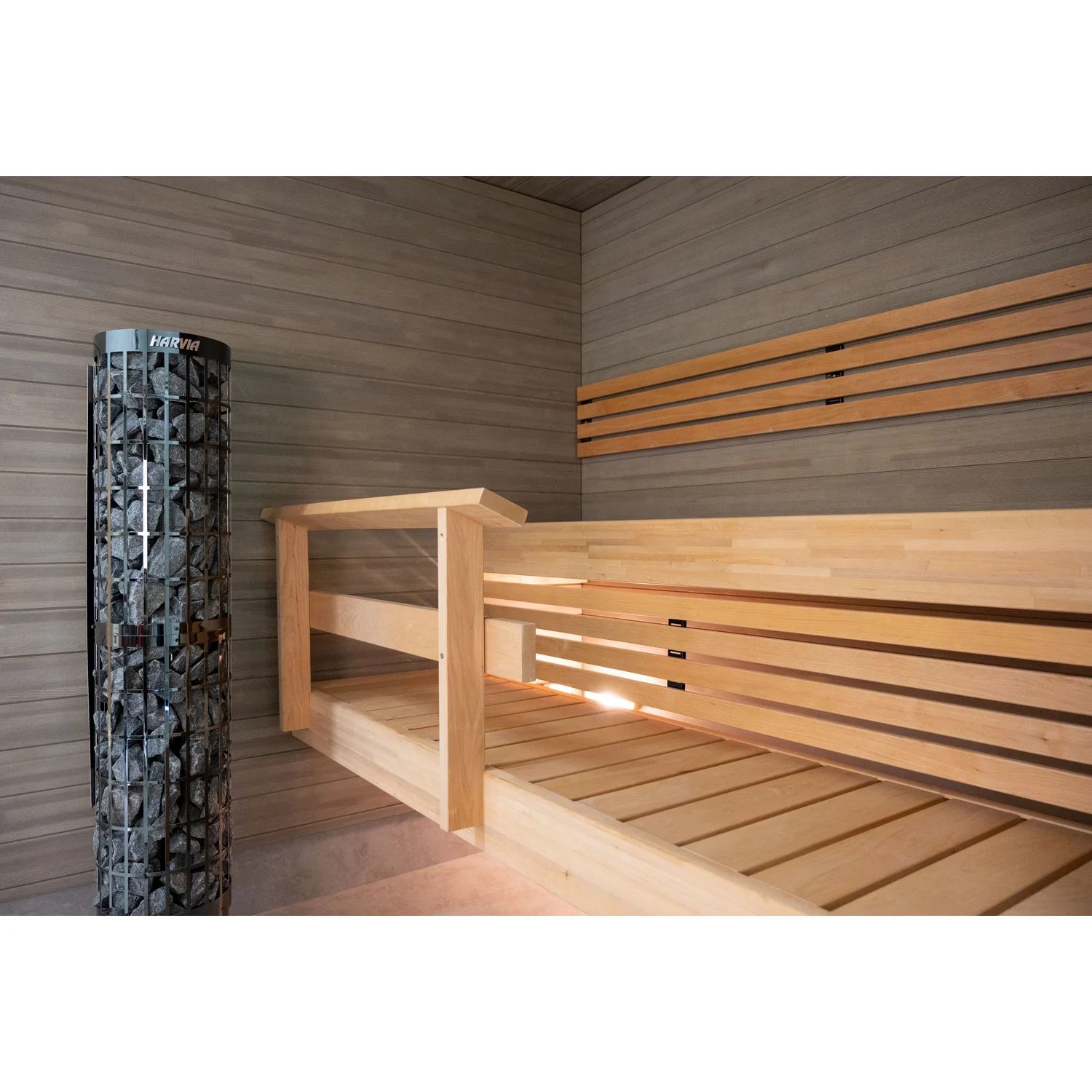 Harvia Cilindro PC66E black steel pillar heater installed in a sauna