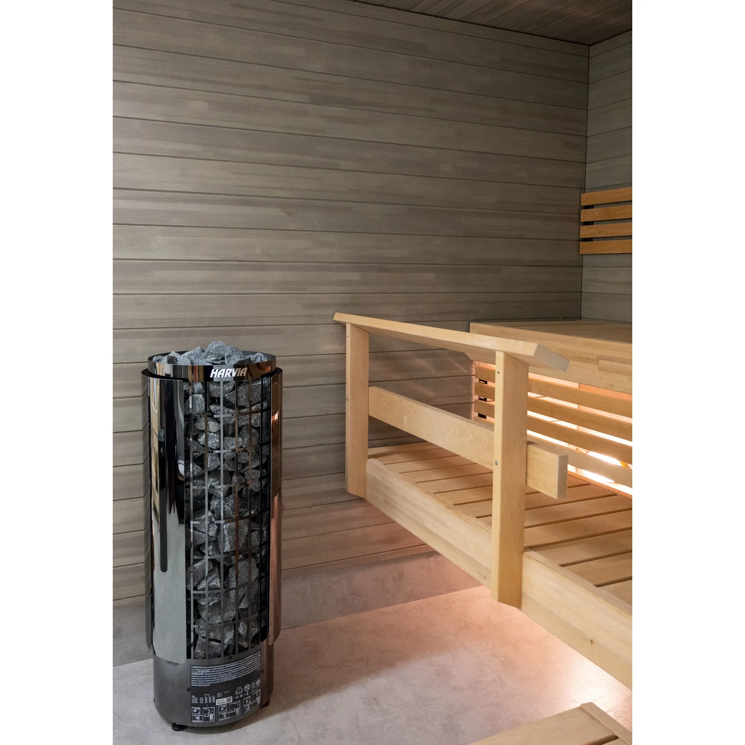 Harvia Cilindro PC70E black steel pillar heater in a sauna room
