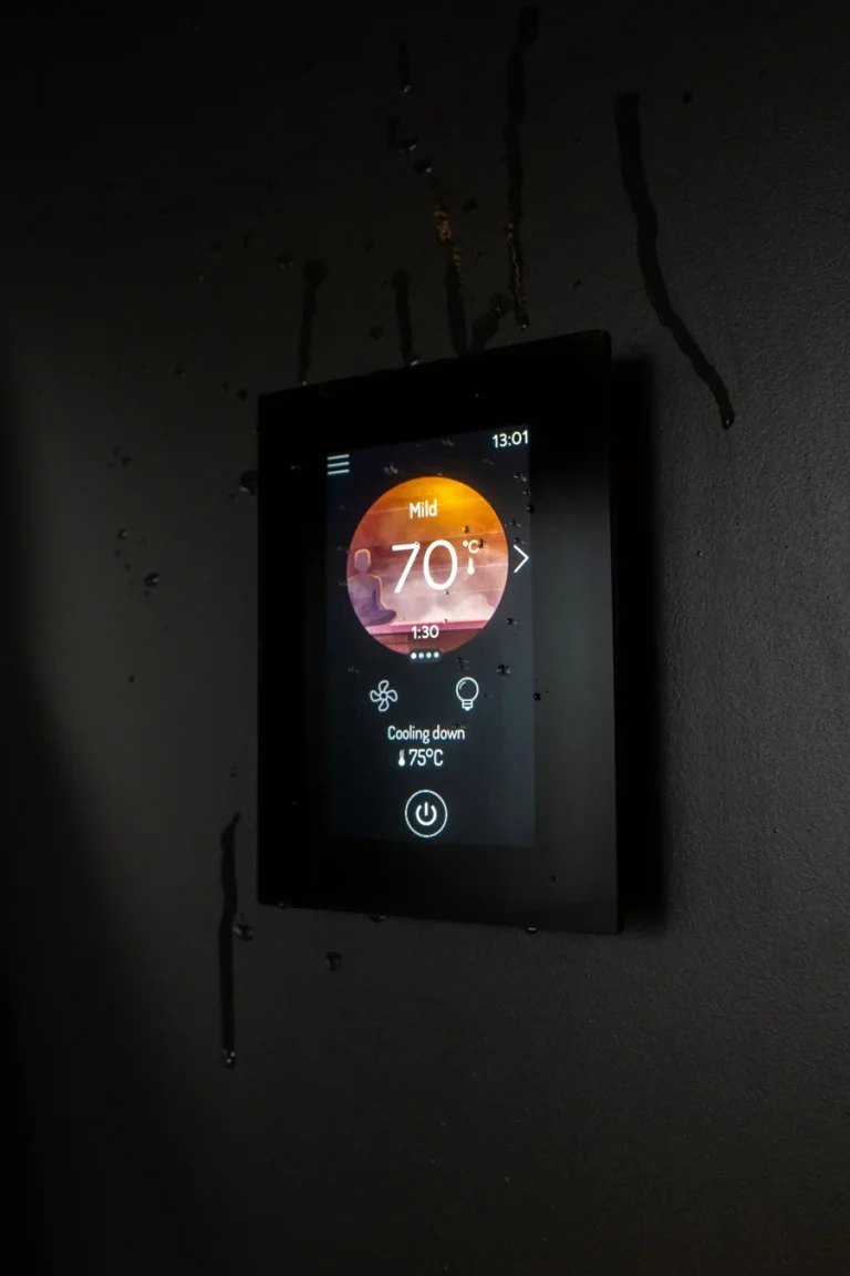 The Harvia Fenix FX001XW touchscreen showing temperature and session status