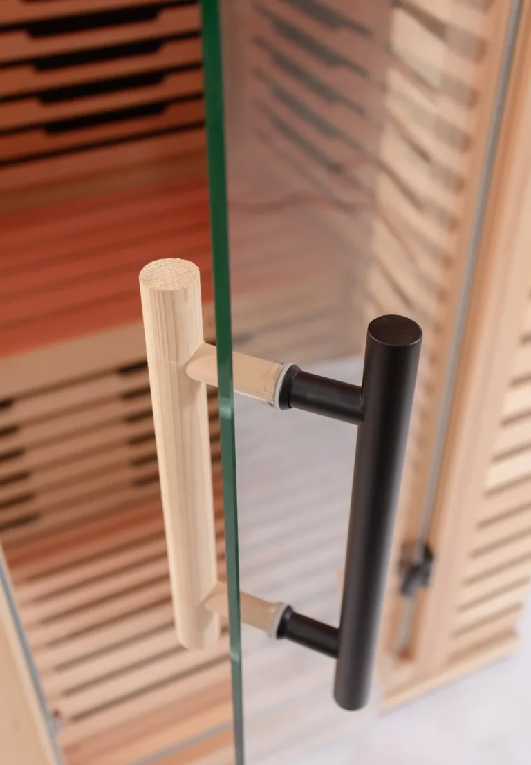 Tempered glass door handles on the Aura Infrared Sauna, close up