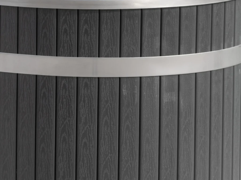 Close view of the PVC cladding and stainless tension band on the cold plunge tub