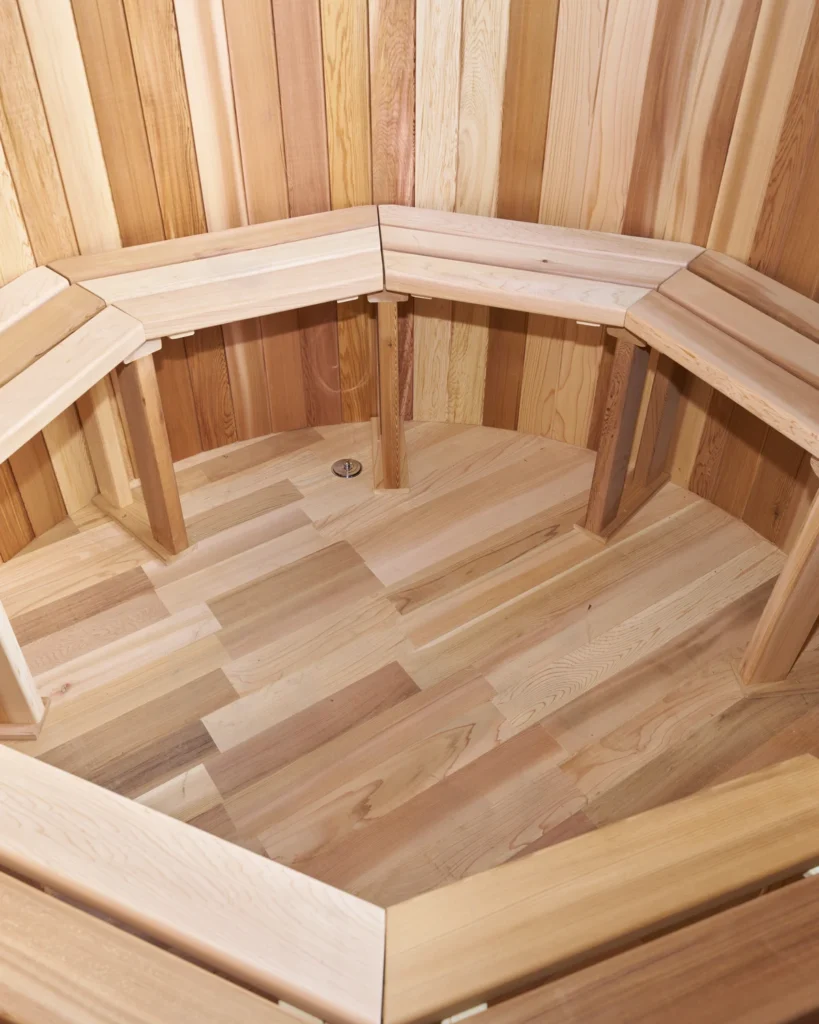 Inside the cedar hot tub showing the bench seating and floor