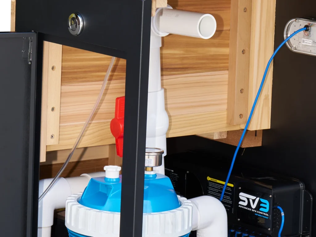 Inside the equipment cabinet showing the SpaNET control unit, pump and filter