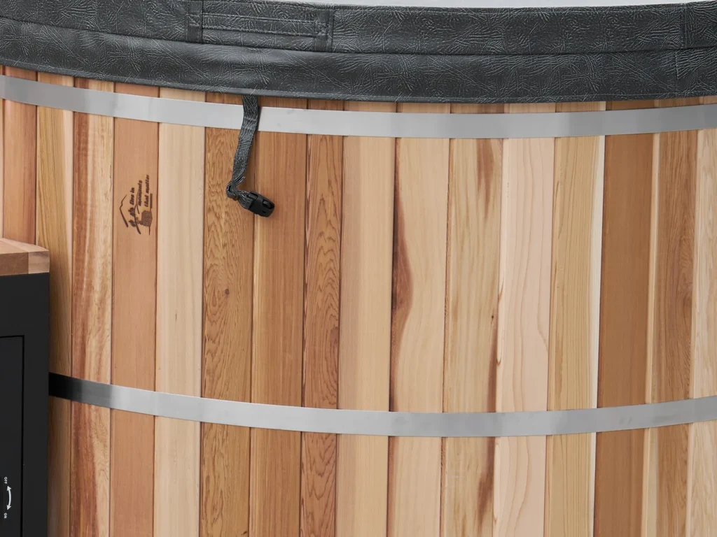 The insulated thermal cover fitted to the cedar hot tub
