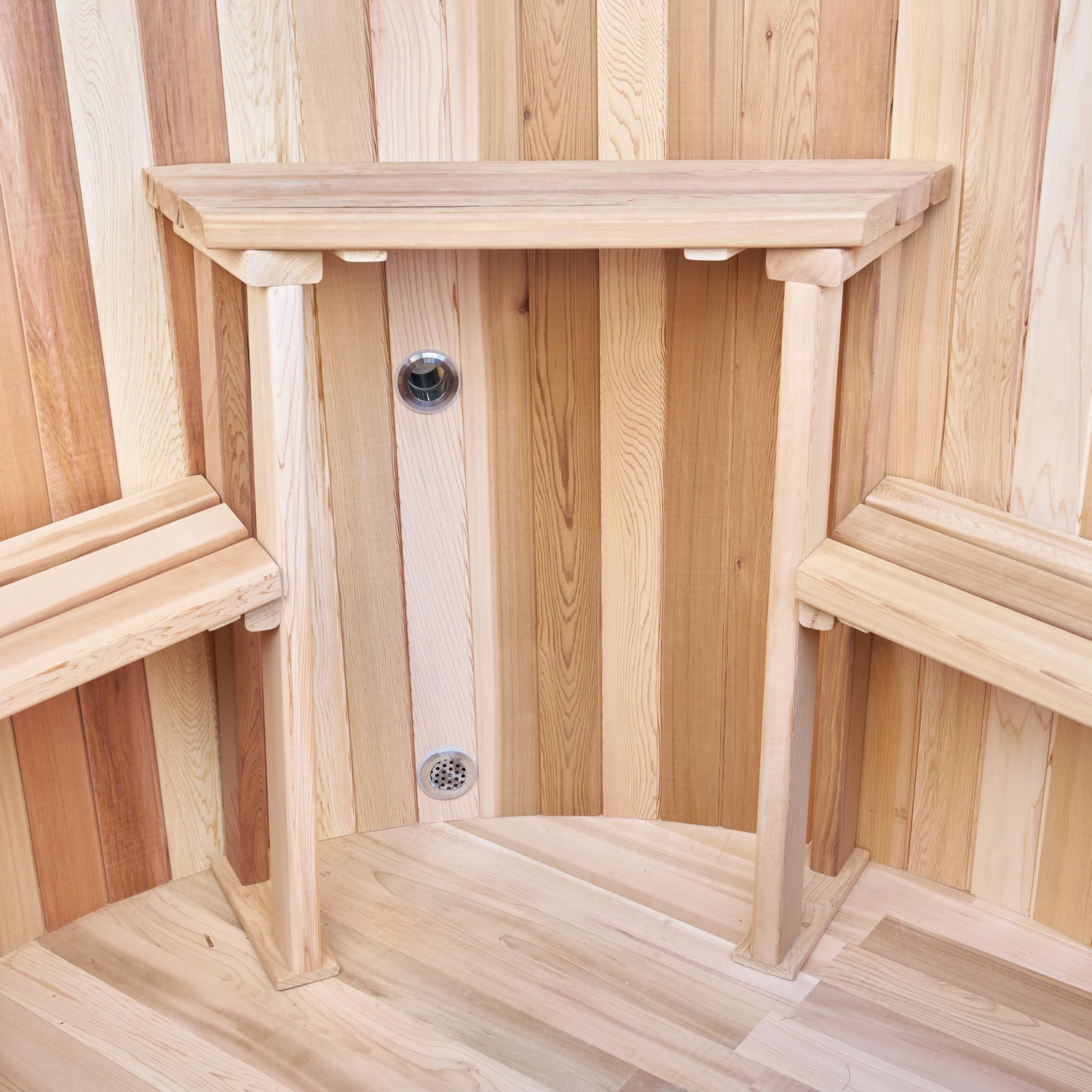 Cedar bench, backrest and inlet fitting inside the hot tub