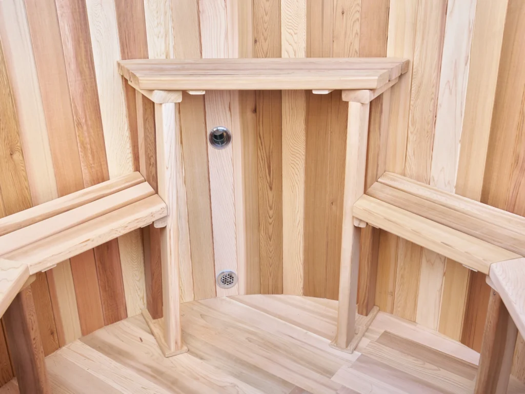 Cedar bench, backrest and inlet fitting inside the hot tub