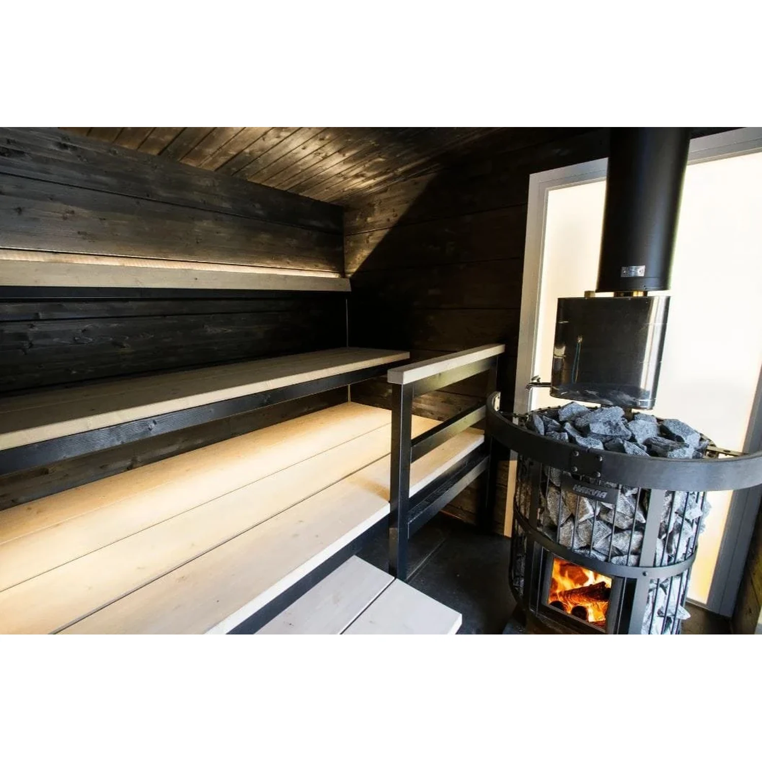 Harvia Legend 150 installed in a dark timber sauna room