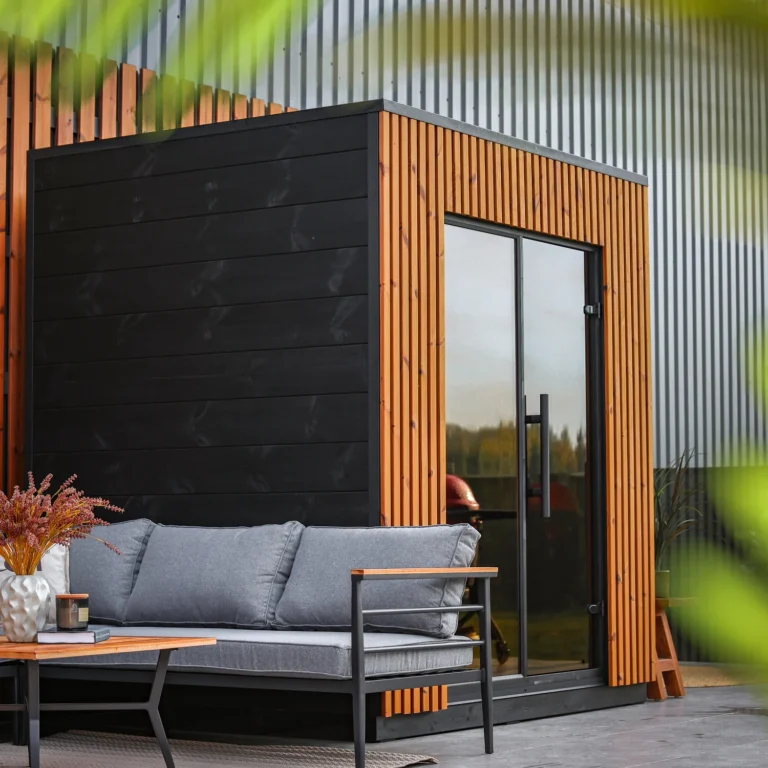 Leil Viva 210 outdoor sauna with outdoor lounge setting