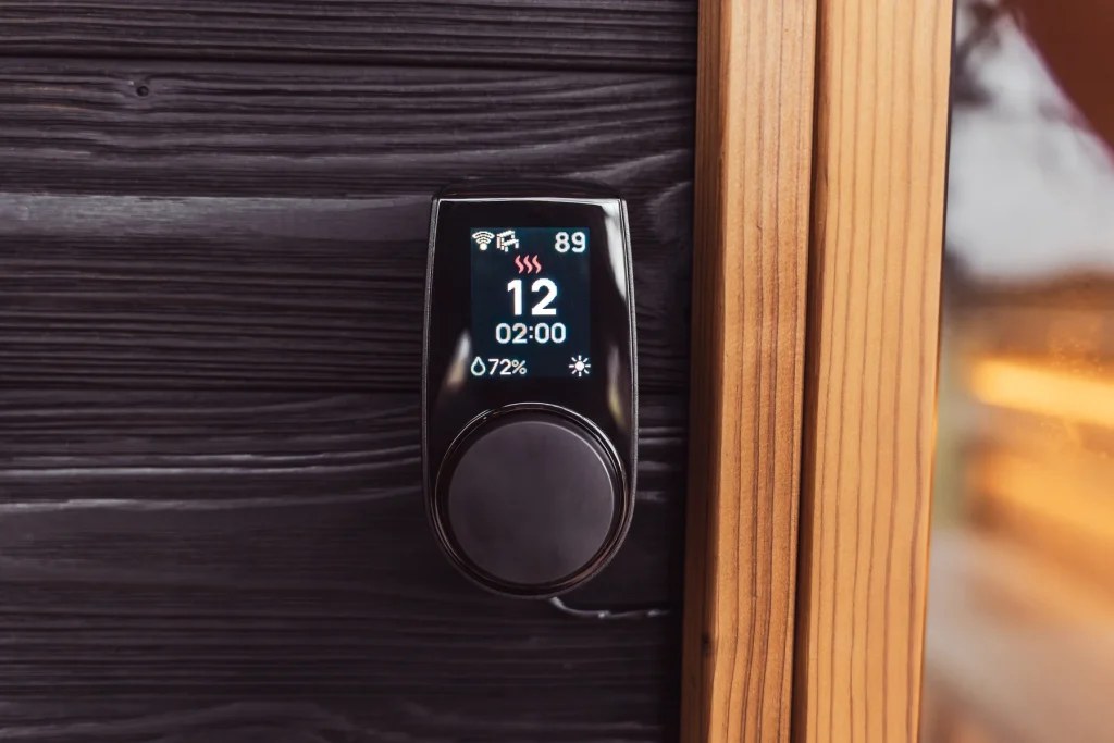 HUUM UKU control panel mounted on a dark timber wall