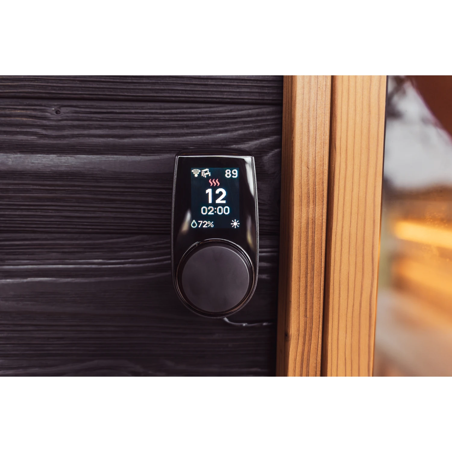 HUUM UKU control panel mounted on a dark timber wall